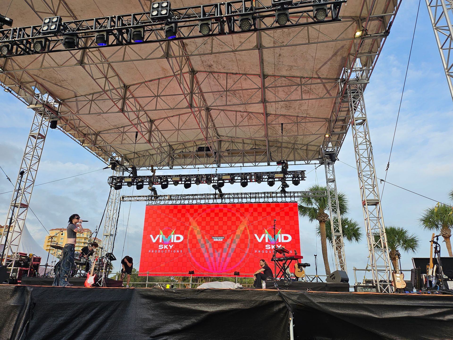 A stage with a large screen that says vivid on it