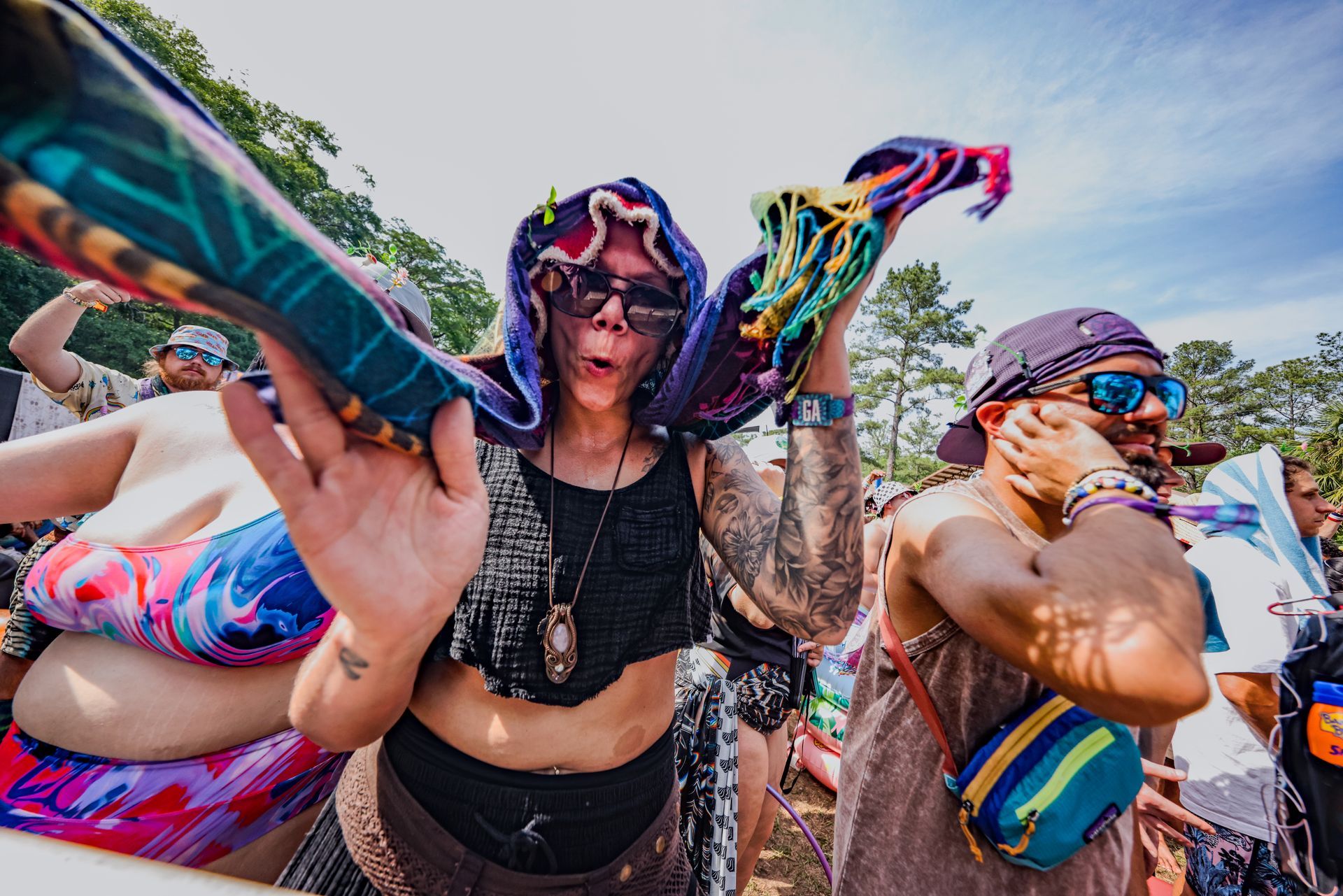 A group of people are standing next to each other at a festival.