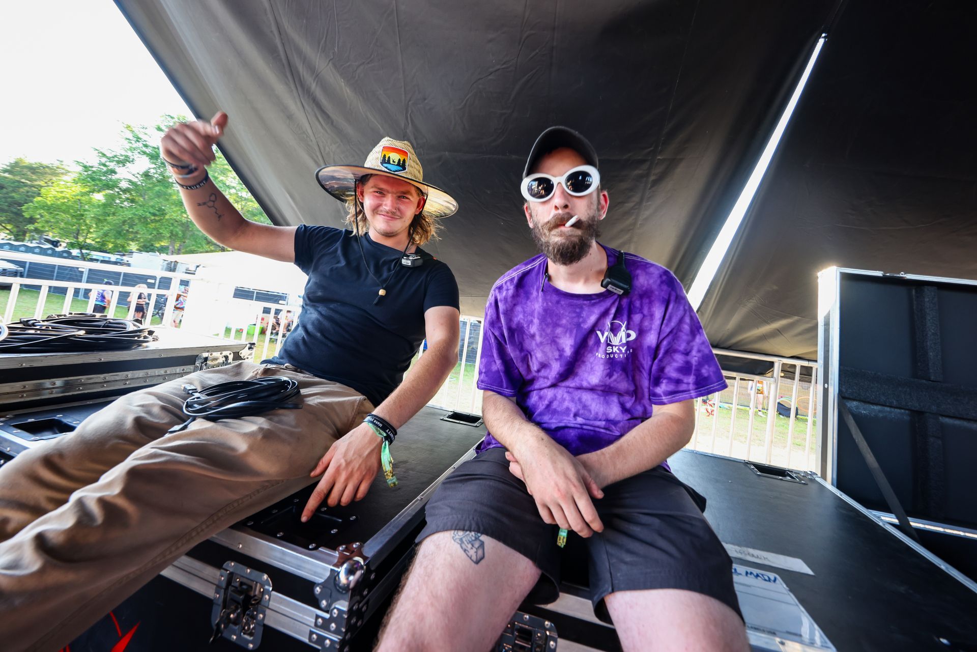 A man and a woman are sitting next to each other on a stage.