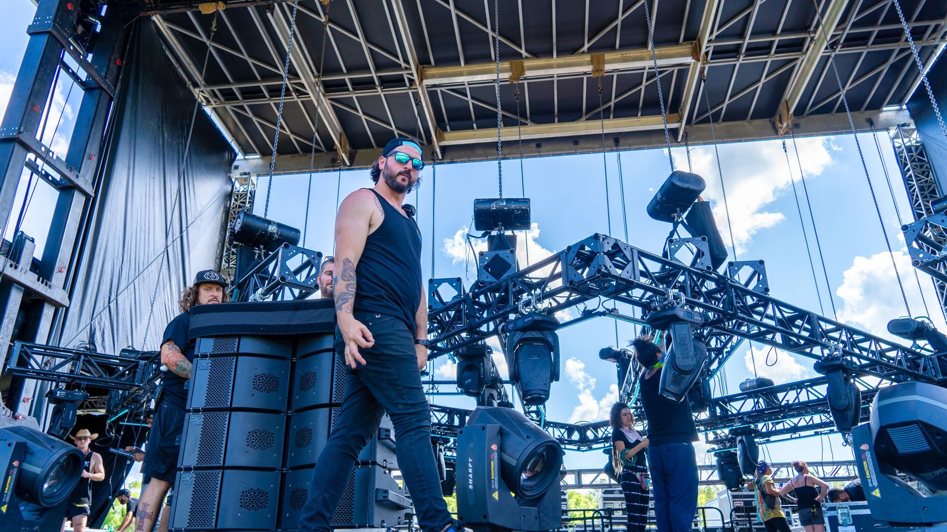 A man is standing on a stage at a concert.