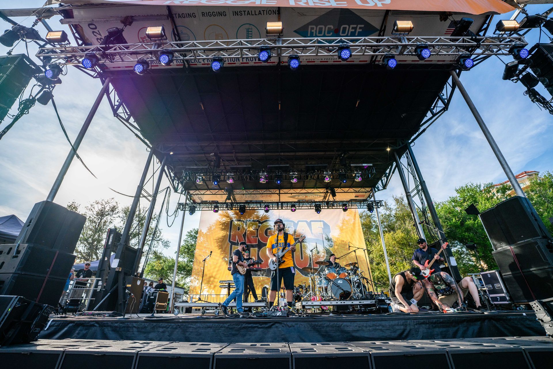 A group of people are playing instruments on a stage.
