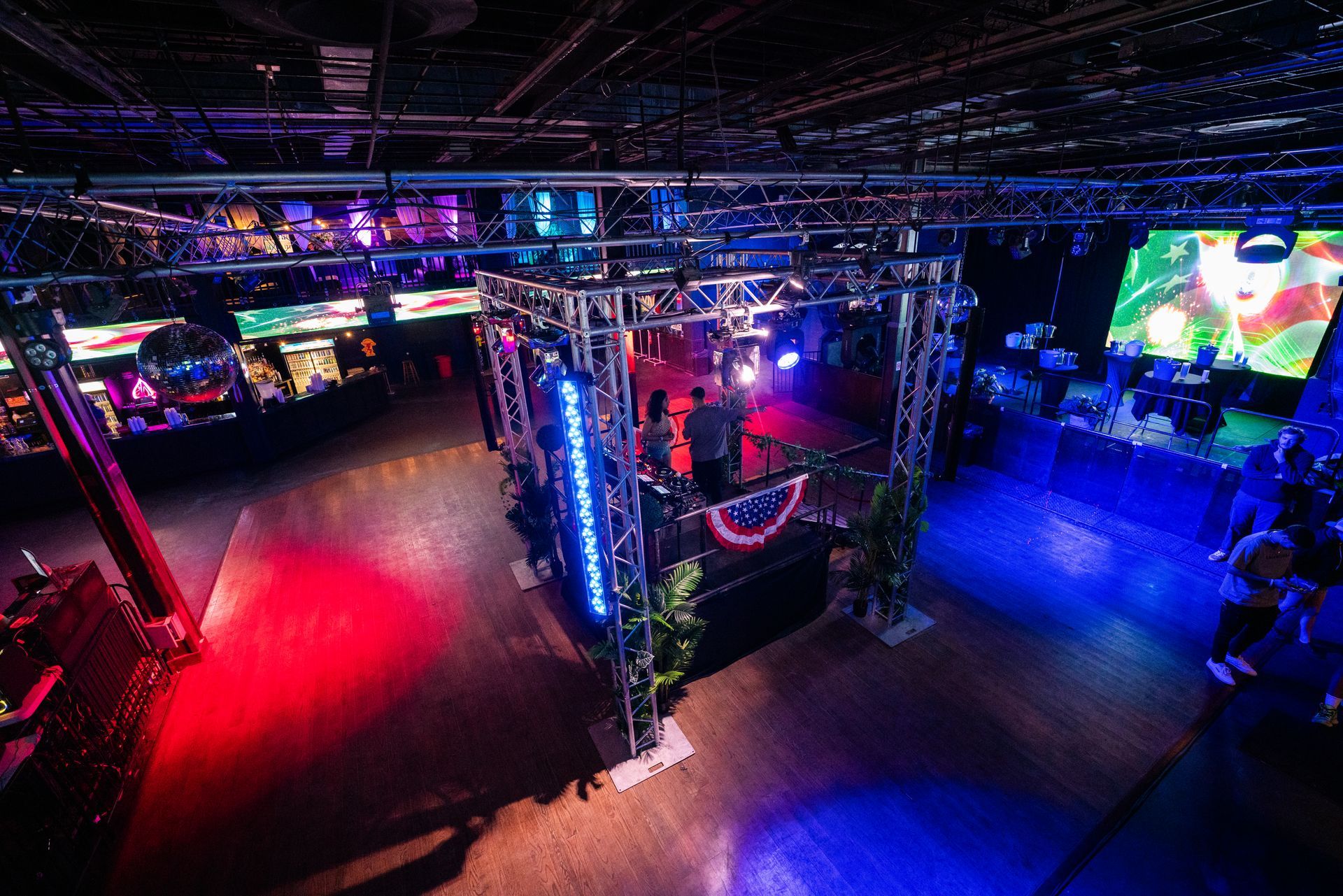 An aerial view of a large room filled with lots of lights.