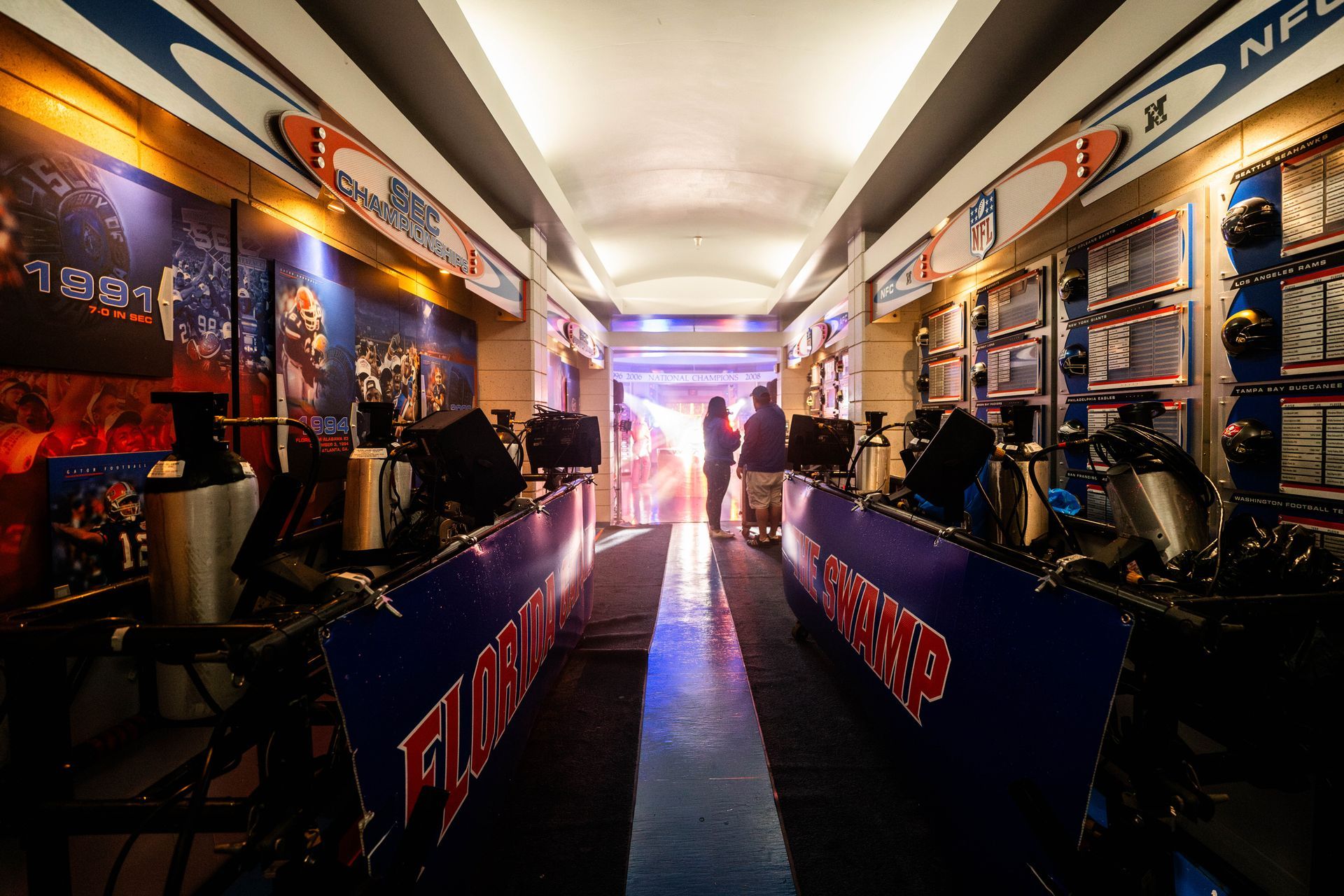 A long hallway with a sign that says nfl on it