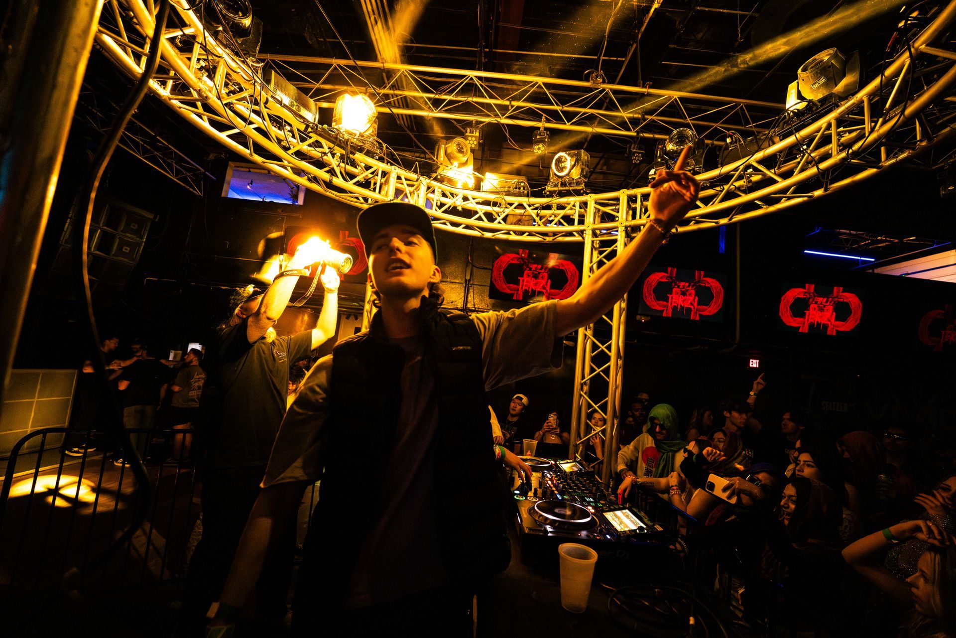 A man is standing in front of a sign that says cad