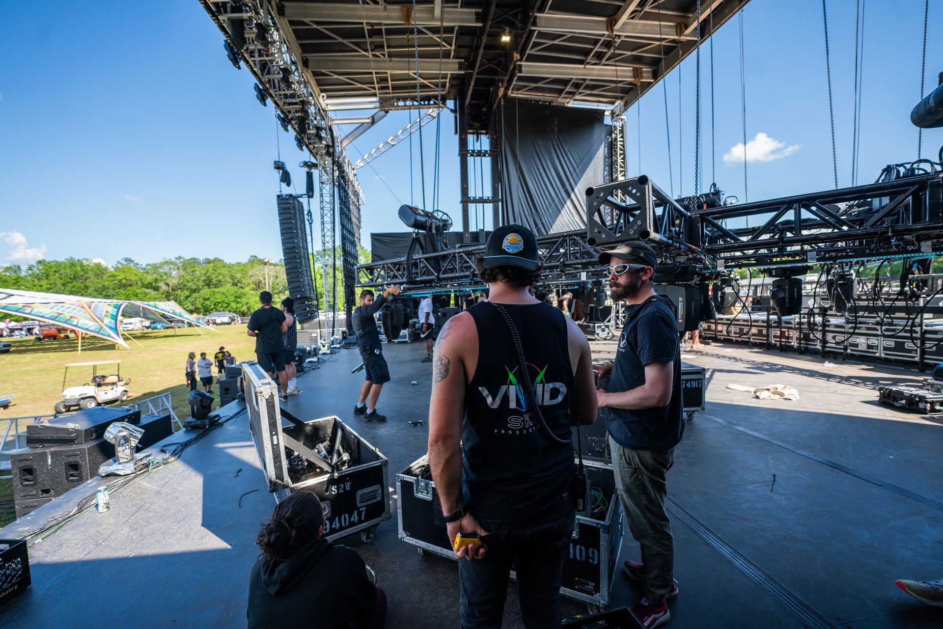 A group of men are standing on top of a stage.
