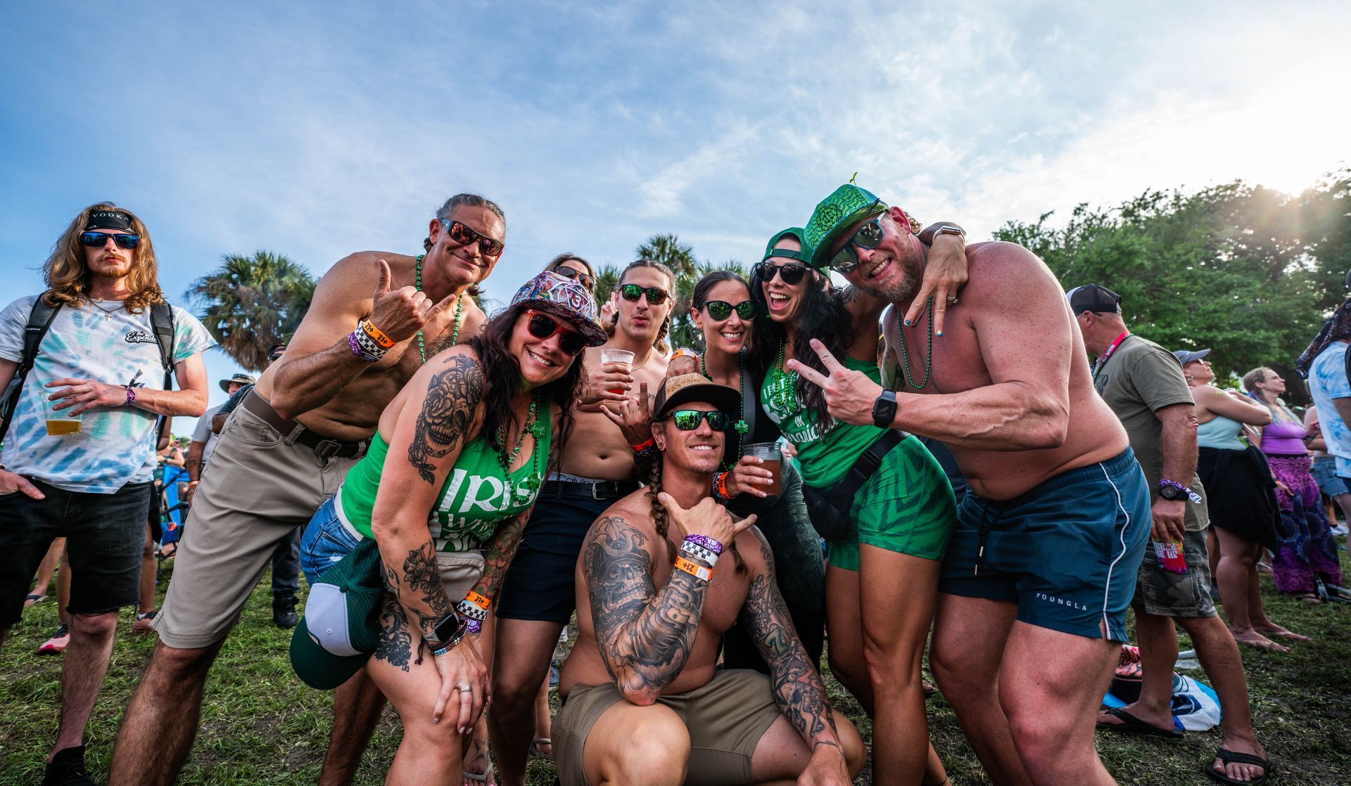 A group of people are posing for a picture at a festival.