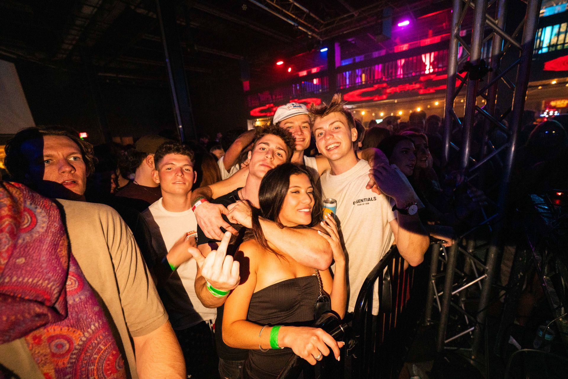 A group of people are posing for a picture at a concert.