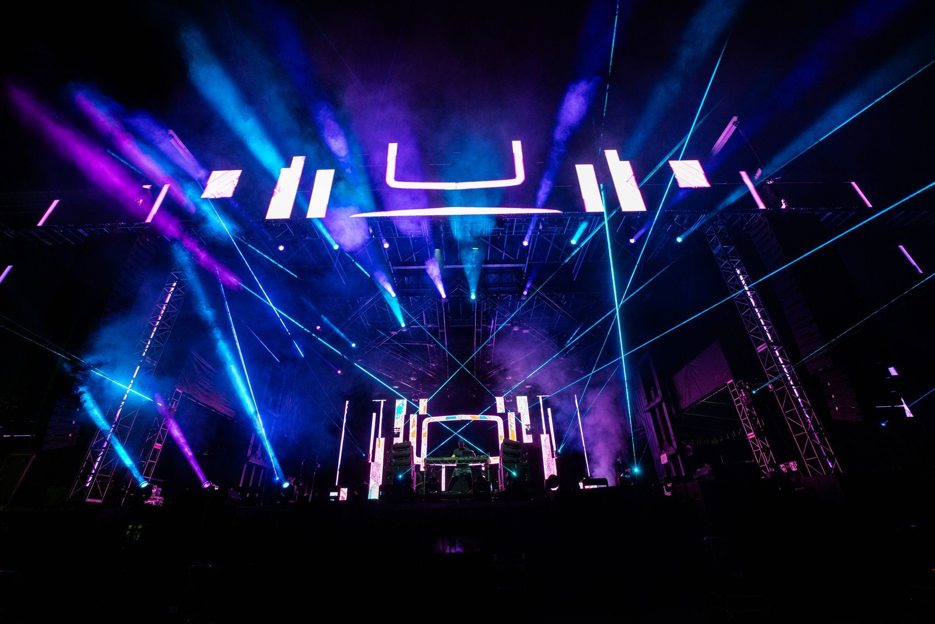 A stage with a lot of lights on it at a concert.