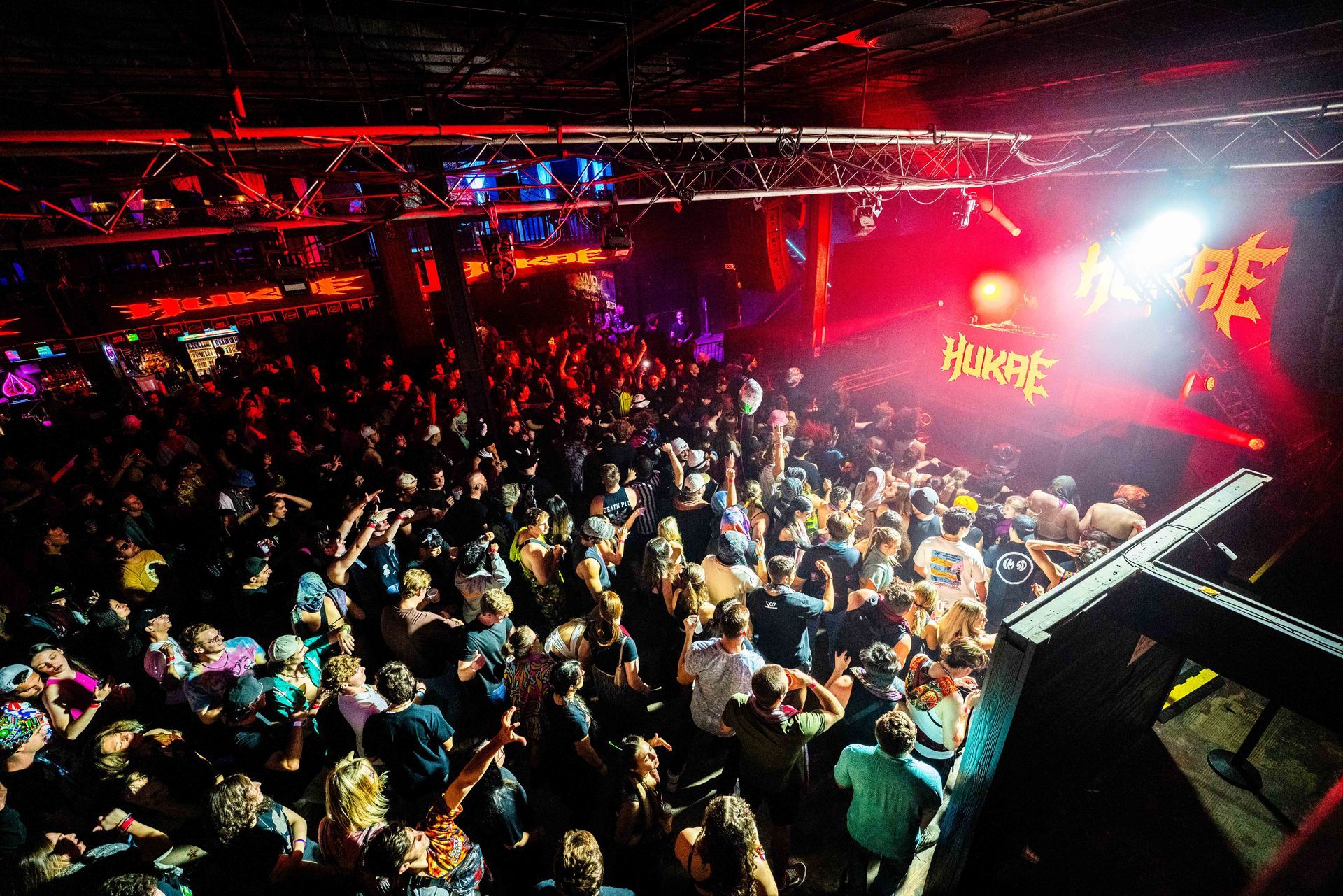 A crowd of people at a concert with the word hook on the stage