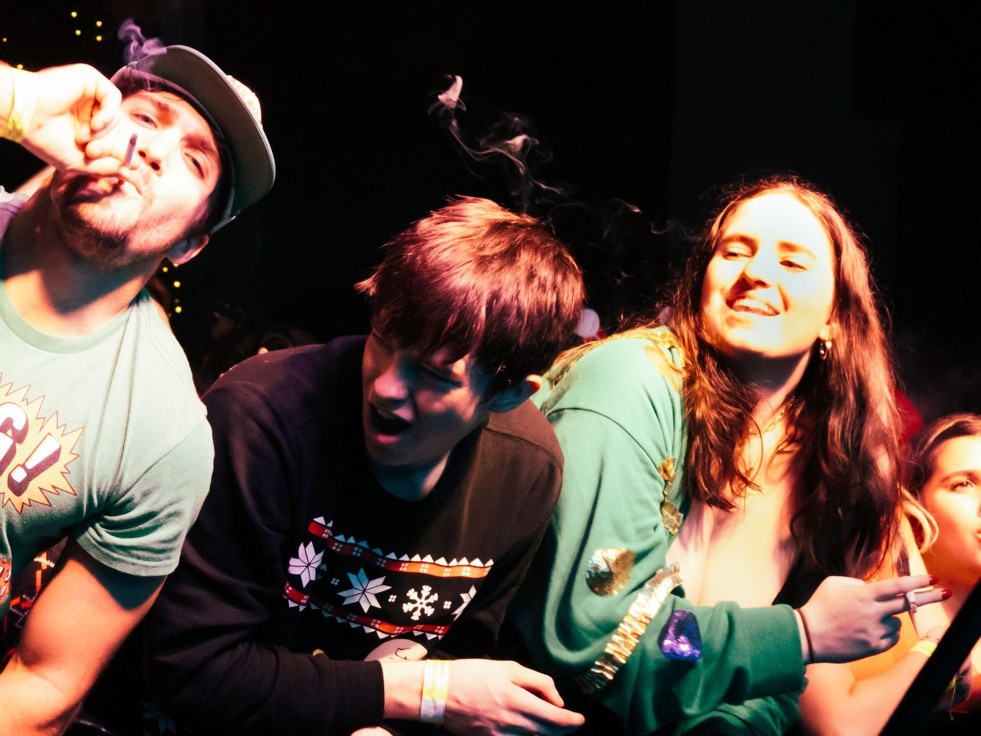 A group of people are posing for a picture and one of them has the number 8 on his shirt