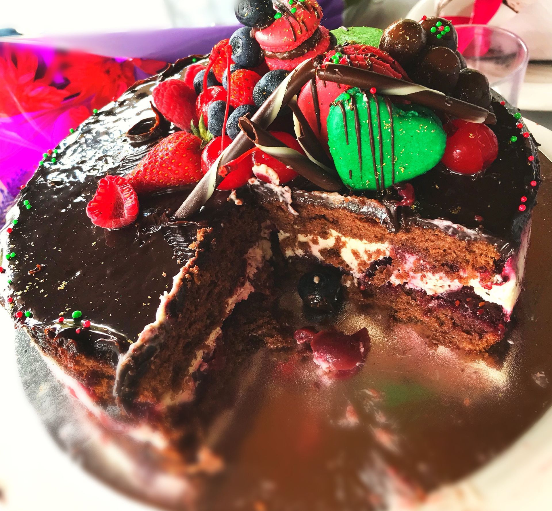 A chocolate cake with a slice taken out of it — My Rainbow Bakery, Cafe & Catering in Cannonvale, QLD