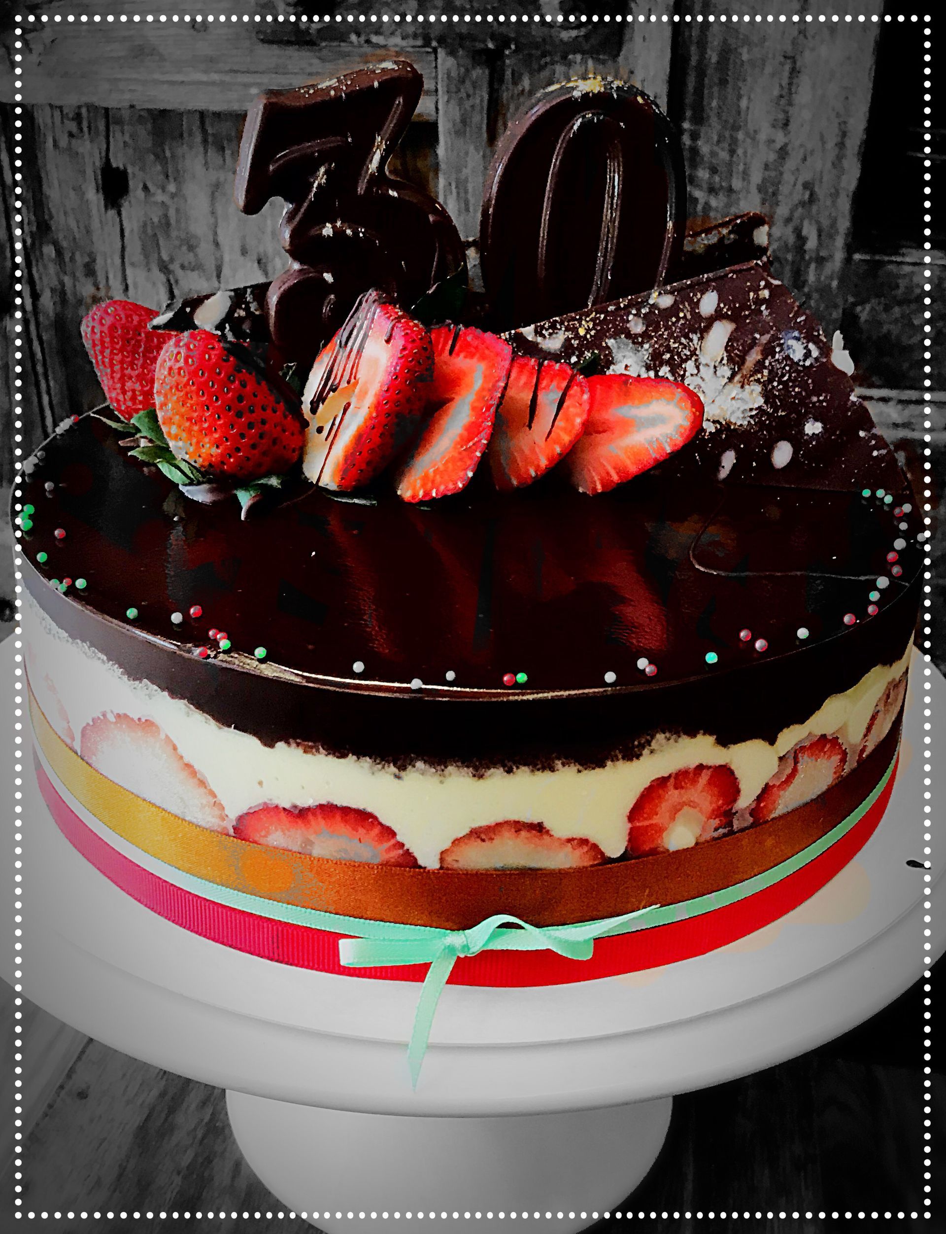 A chocolate cake with strawberries and the number 50 on top — My Rainbow Bakery, Cafe & Catering in Cannonvale, QLD