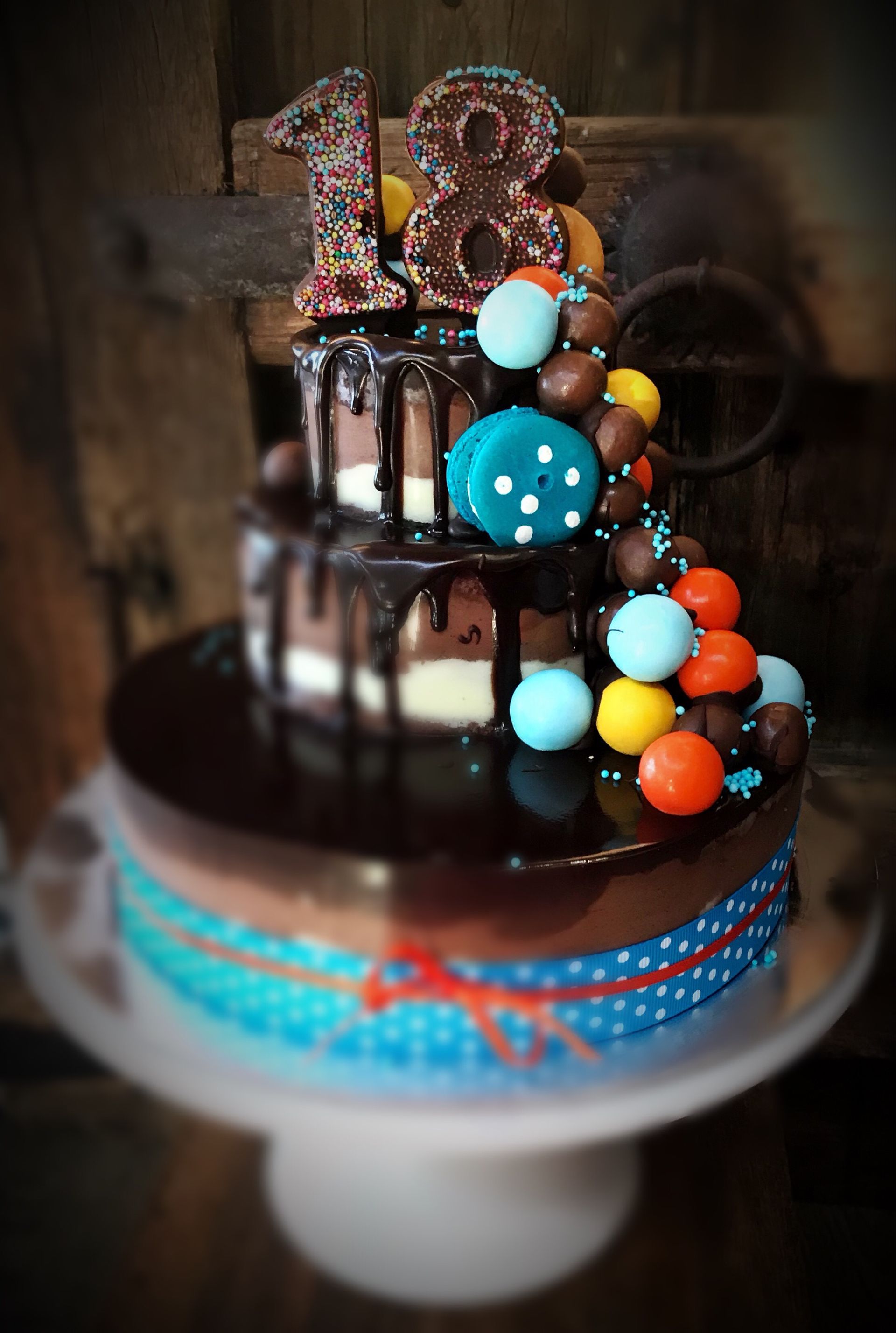 A cake with the number 18 on top of it — My Rainbow Bakery, Cafe & Catering in Cannonvale, QLD