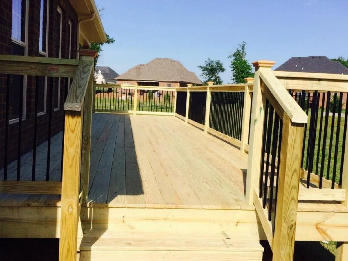 A wooden deck with stairs leading up to it