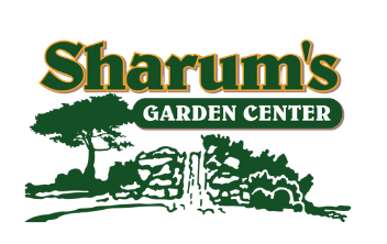 a logo for sharum 's garden center with trees in the background