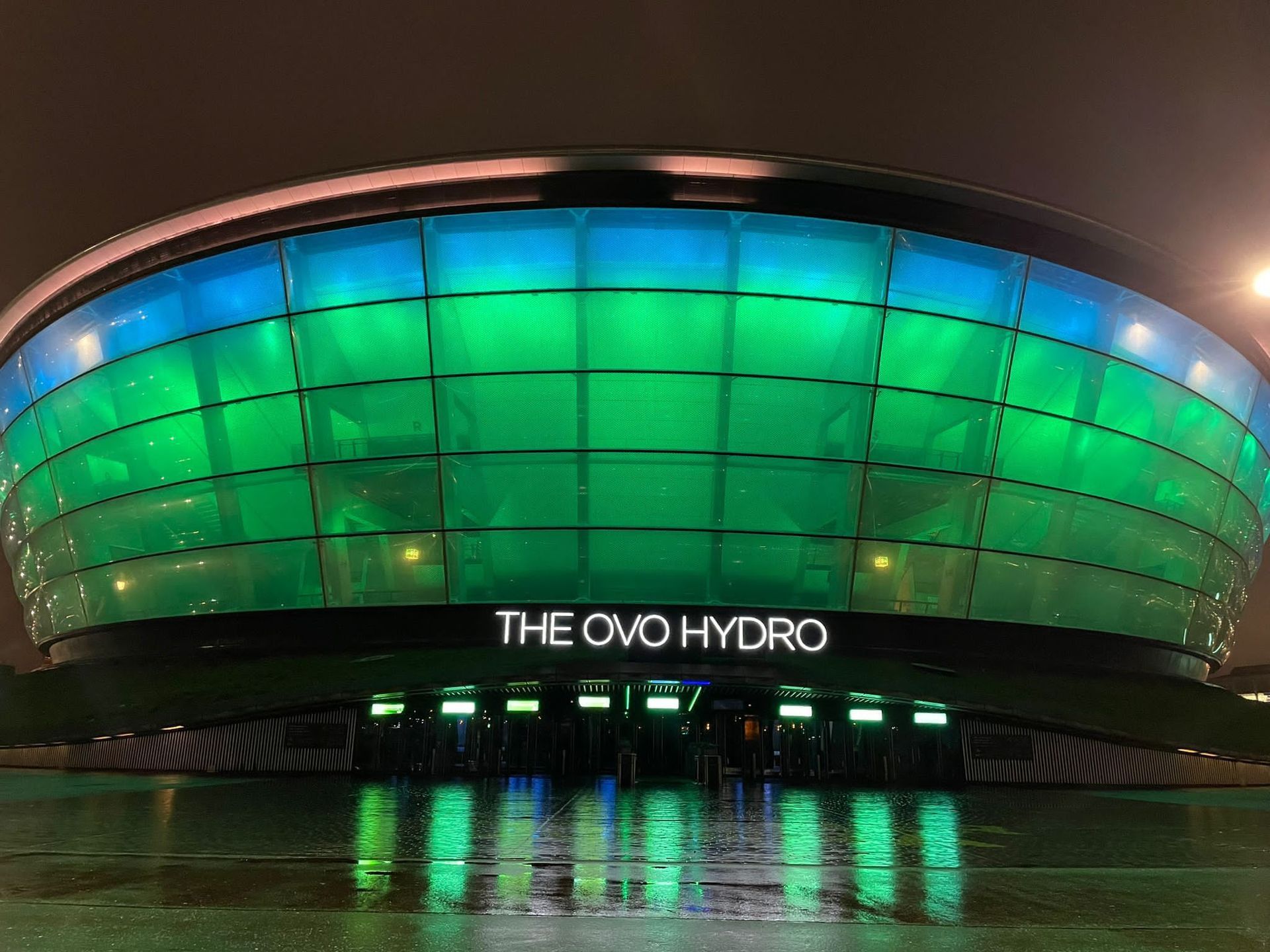 The ovo hydro building is lit up at night