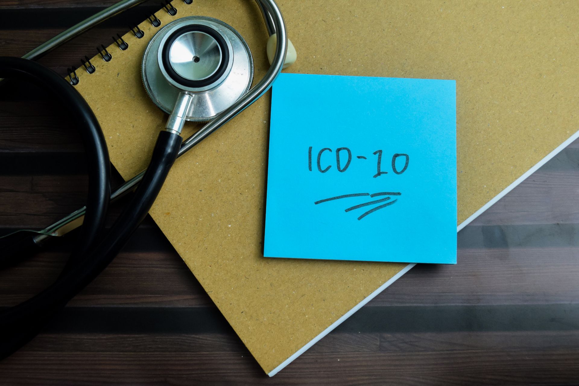 A stethoscope and a note that says icd-10 on it