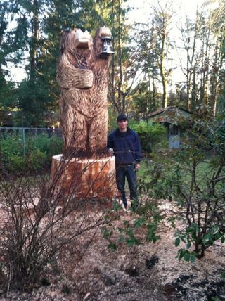 Man With Carved Wood — Shelton, WA — Beko's Trees LLC & Wood Carving