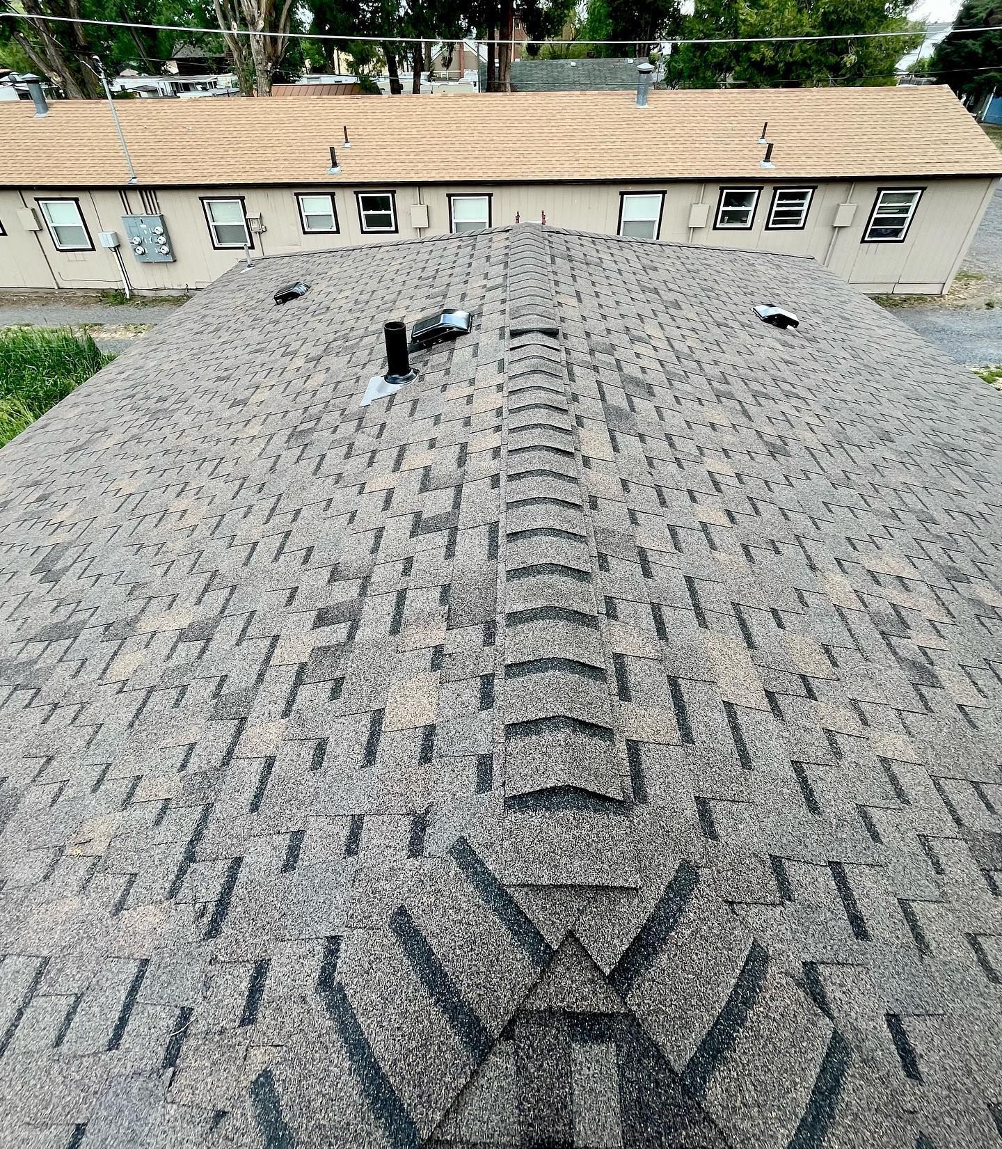A close up of a roof with a lot of shingles on it.