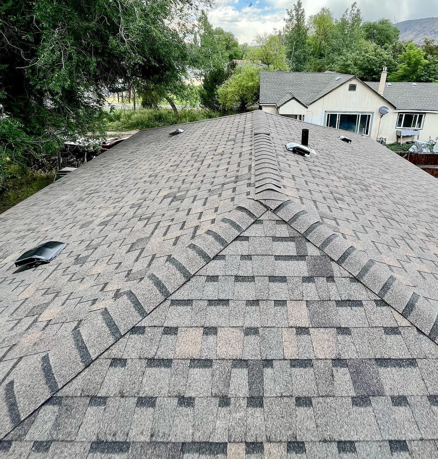 A roof of a house with a lot of shingles on it.