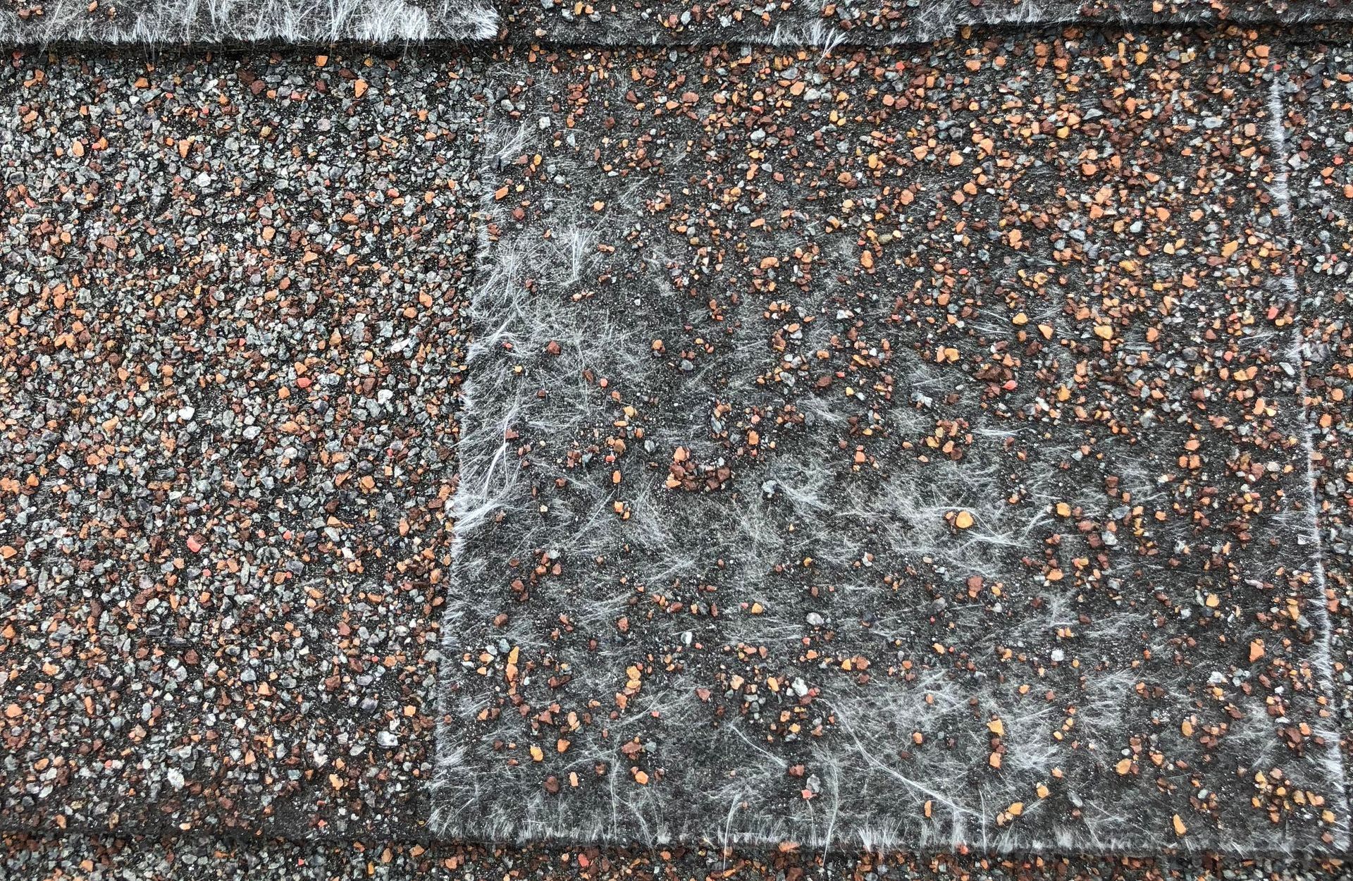 A close up of a roof with shingles on it.