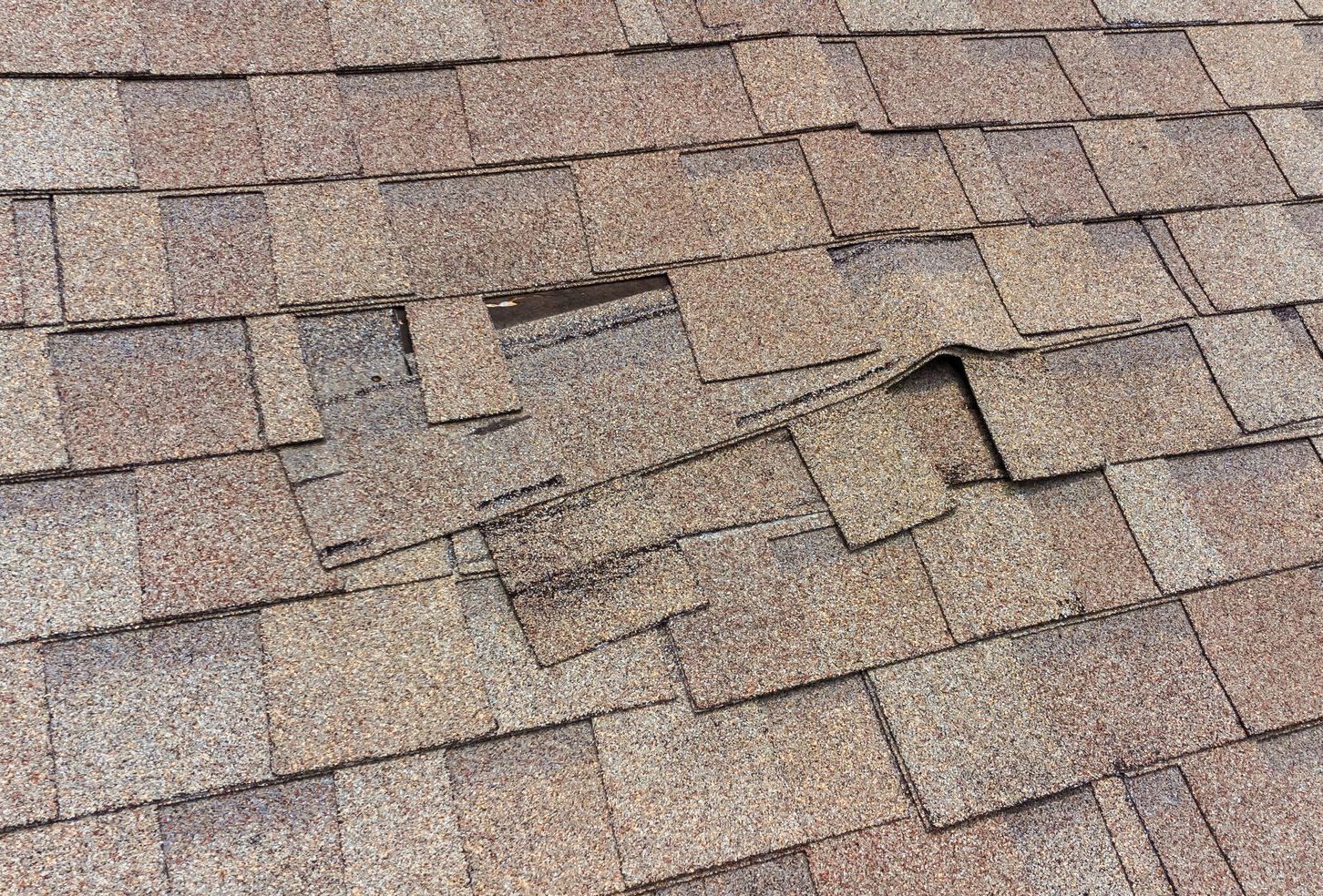 A close up of a roof with a hole in it.