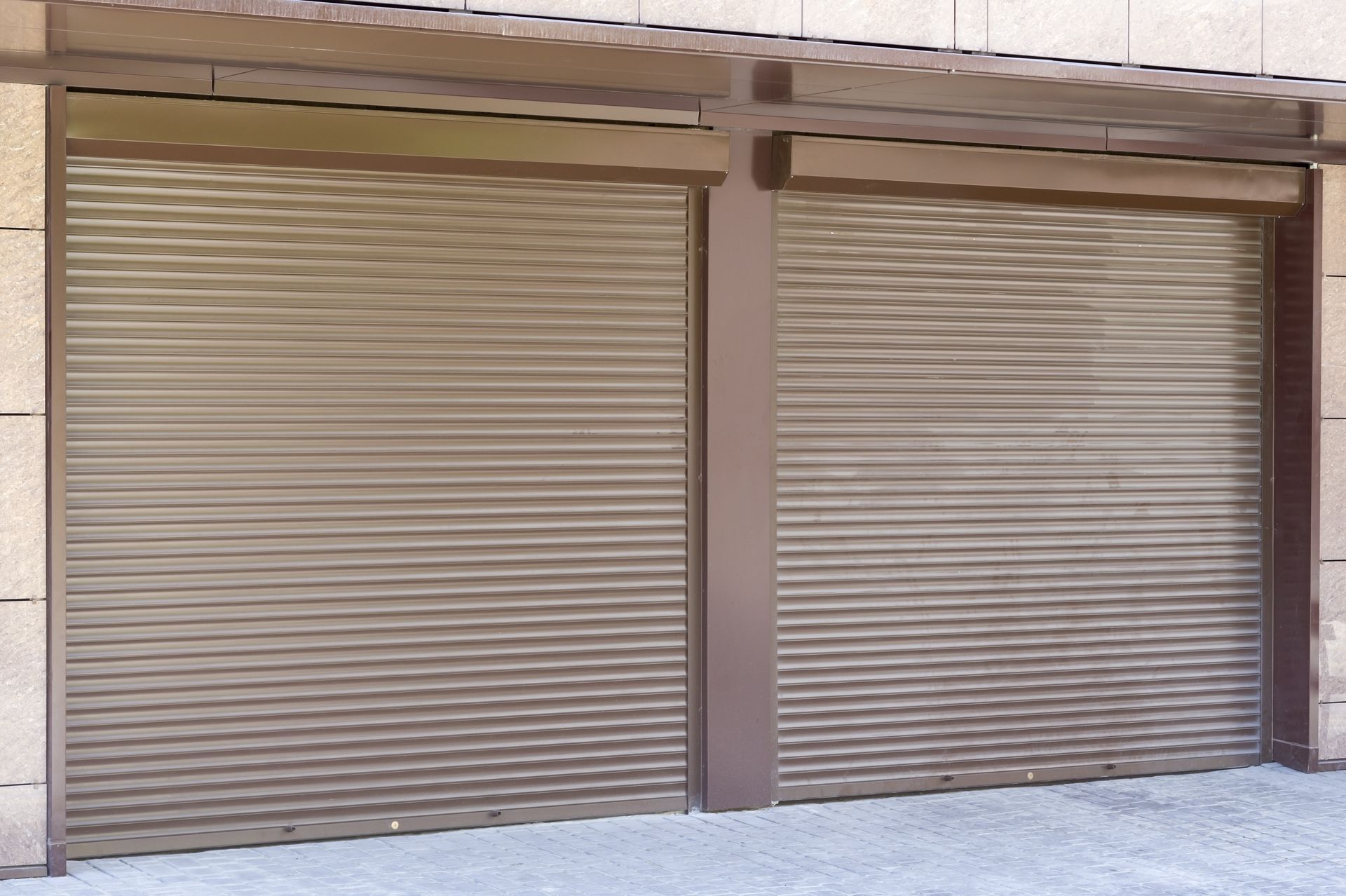 A pair of garage doors are closed on a building.