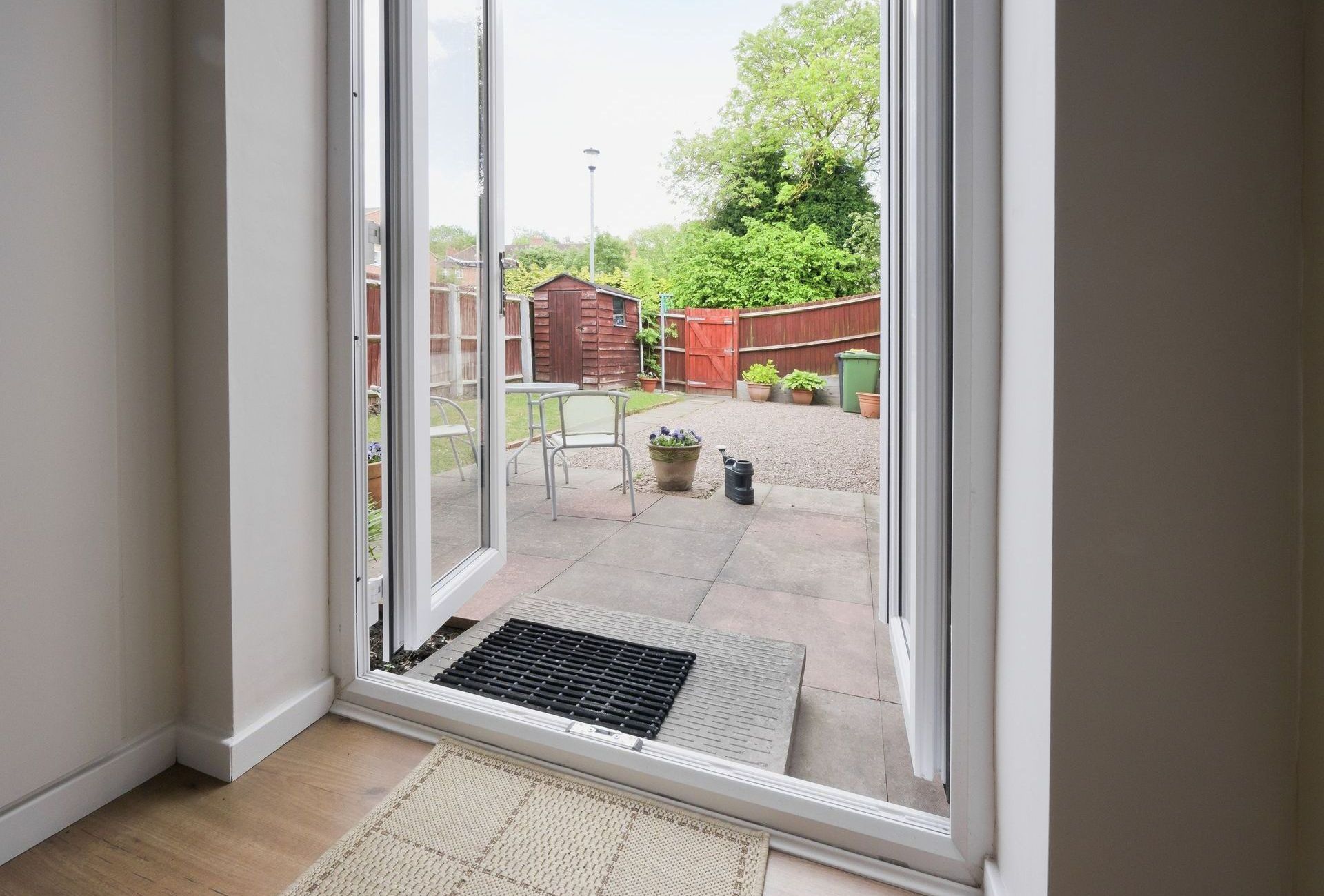 A room with a sliding glass door leading to a patio.