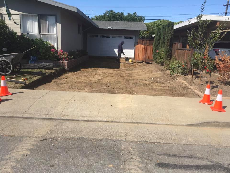 Worker laying out groundwork for driveway construction — Palo Alto, CA — T & S Construction