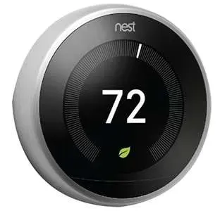 Nest thermostat display showing 72 degrees with a green leaf icon on a black circular screen
