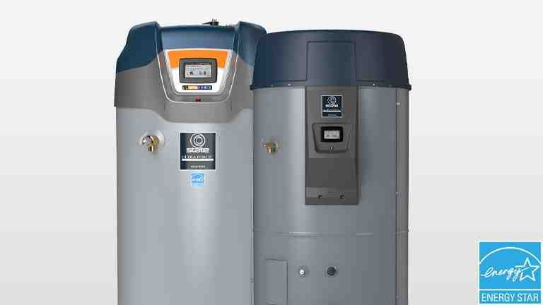 Two upright water heaters, one silver-gray and one dark gray, against a white background