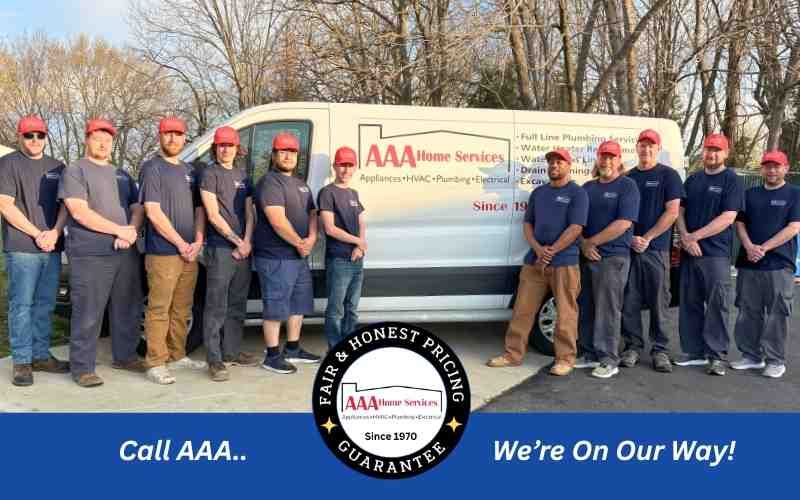 AAA roadside assistance crew lined up beside a service van outdoors, with “Call AAA” and “We’re On Our Way!” text.
