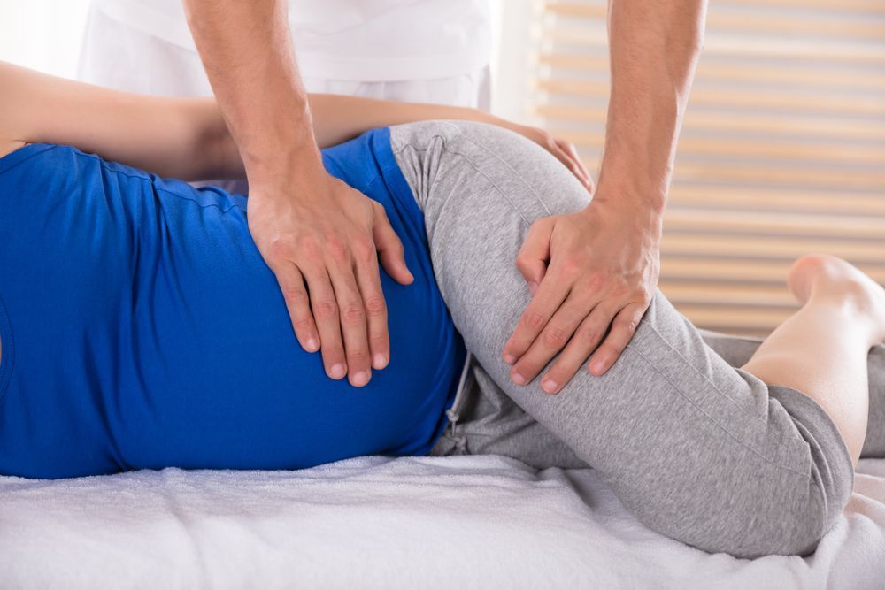 Pregnant Woman Receiving Hip Massage — R & R Relaxation and Remedial In Evans Head, NSW