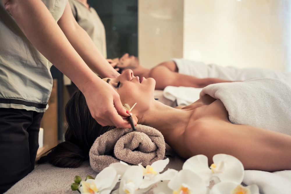 Woman Receiving Ear Candling Treatment at A Spa — R & R Relaxation and Remedial In Northern Rivers, NSW