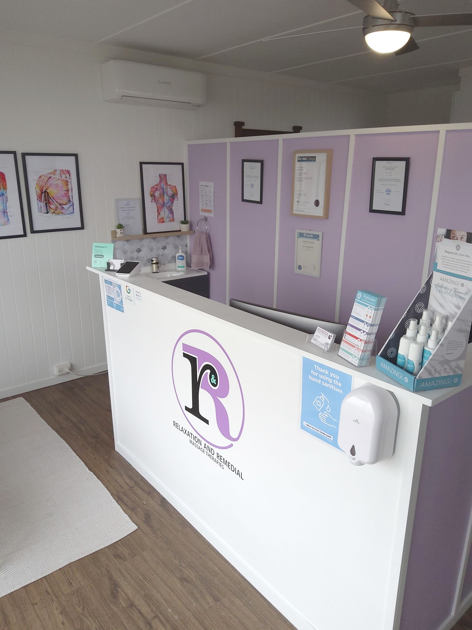 White Reception Desk with Logo — R & R Relaxation and Remedial In Yamba, NSW