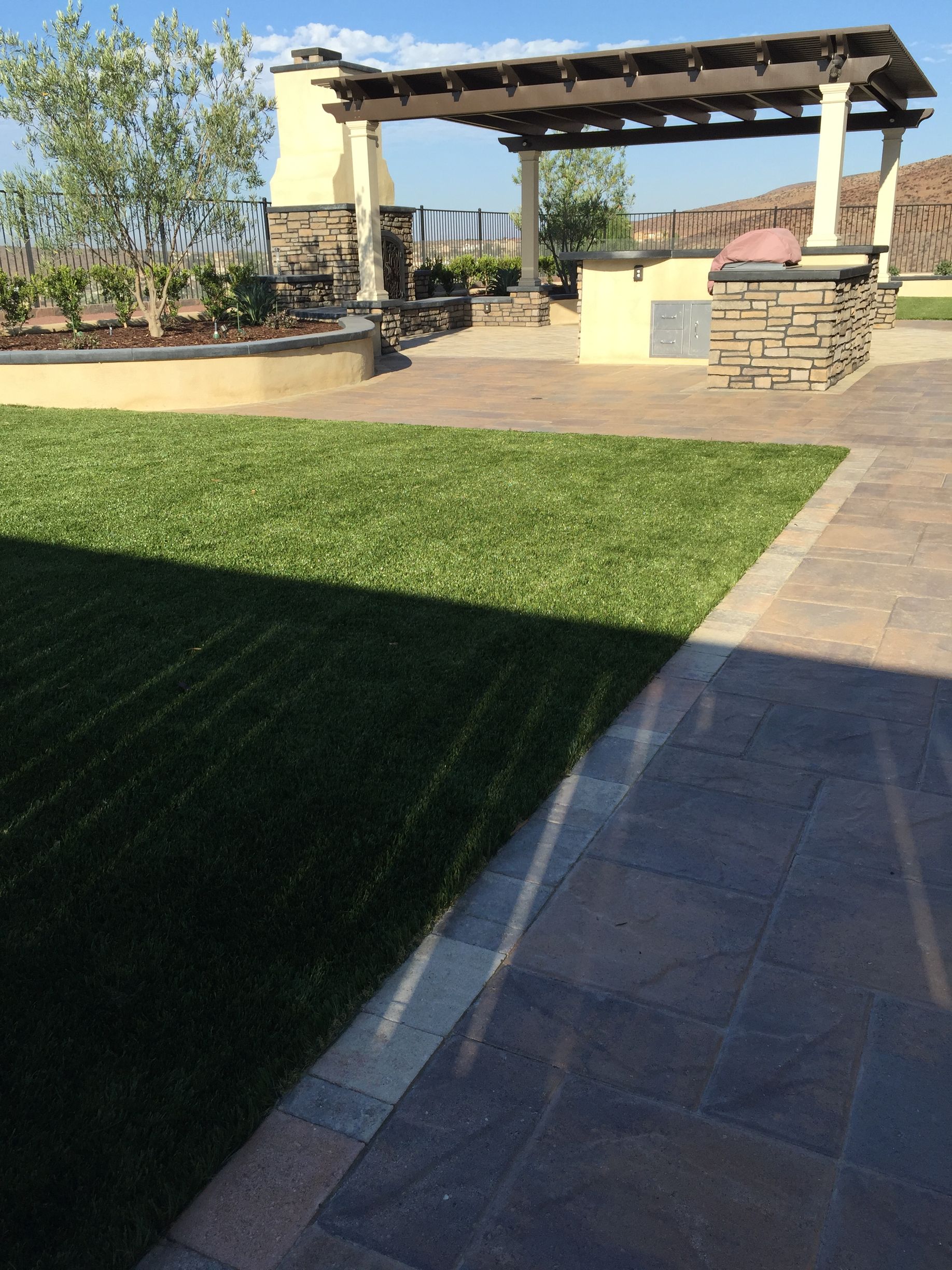 Backyard artificial turf installation by San Diego turf specialists for a clean, green look