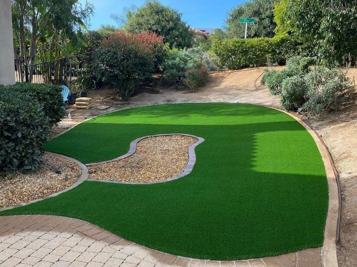 Small backyard remodel featuring garden and multi-use outdoor patio space