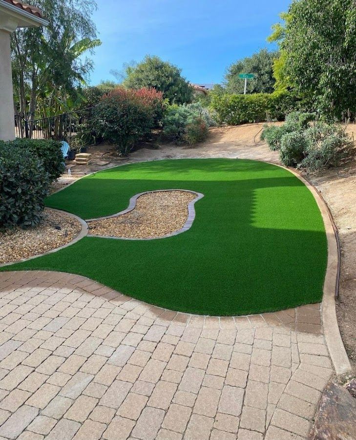 Small backyard makeover with artificial turf in San Diego home