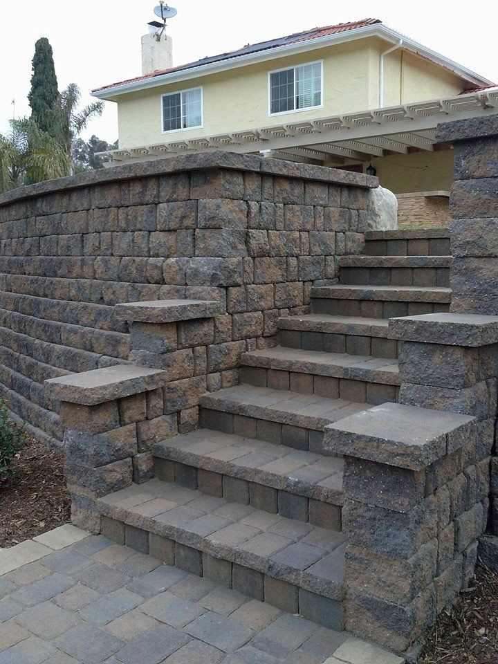 Tiered retaining walls with lighting for a sleek hillside upgrade