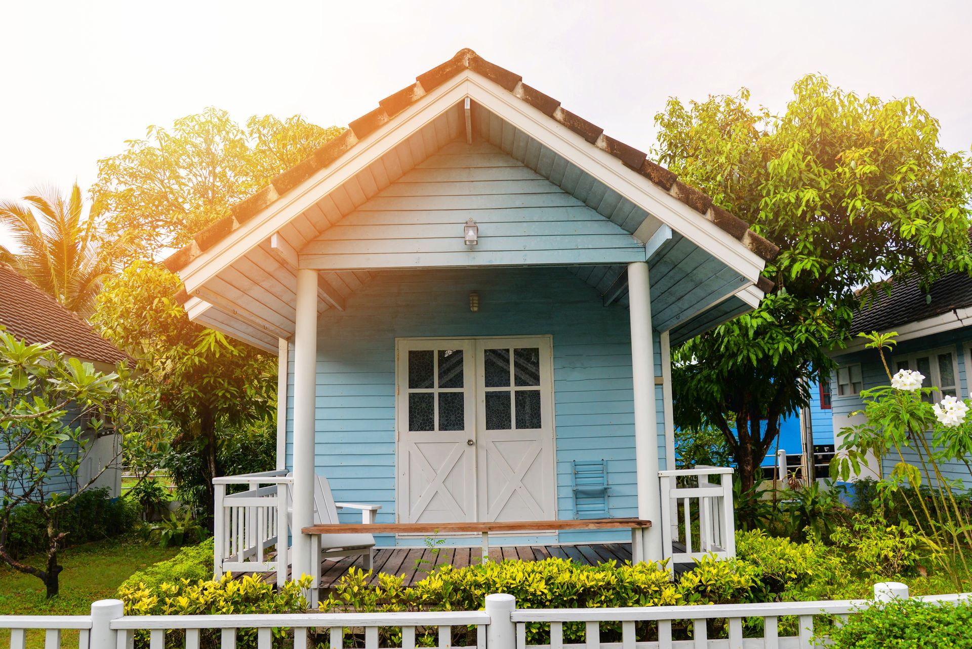 Blue House With White Trim — Bundy Tiny Homes and Carports in Burnett Heads, QLD