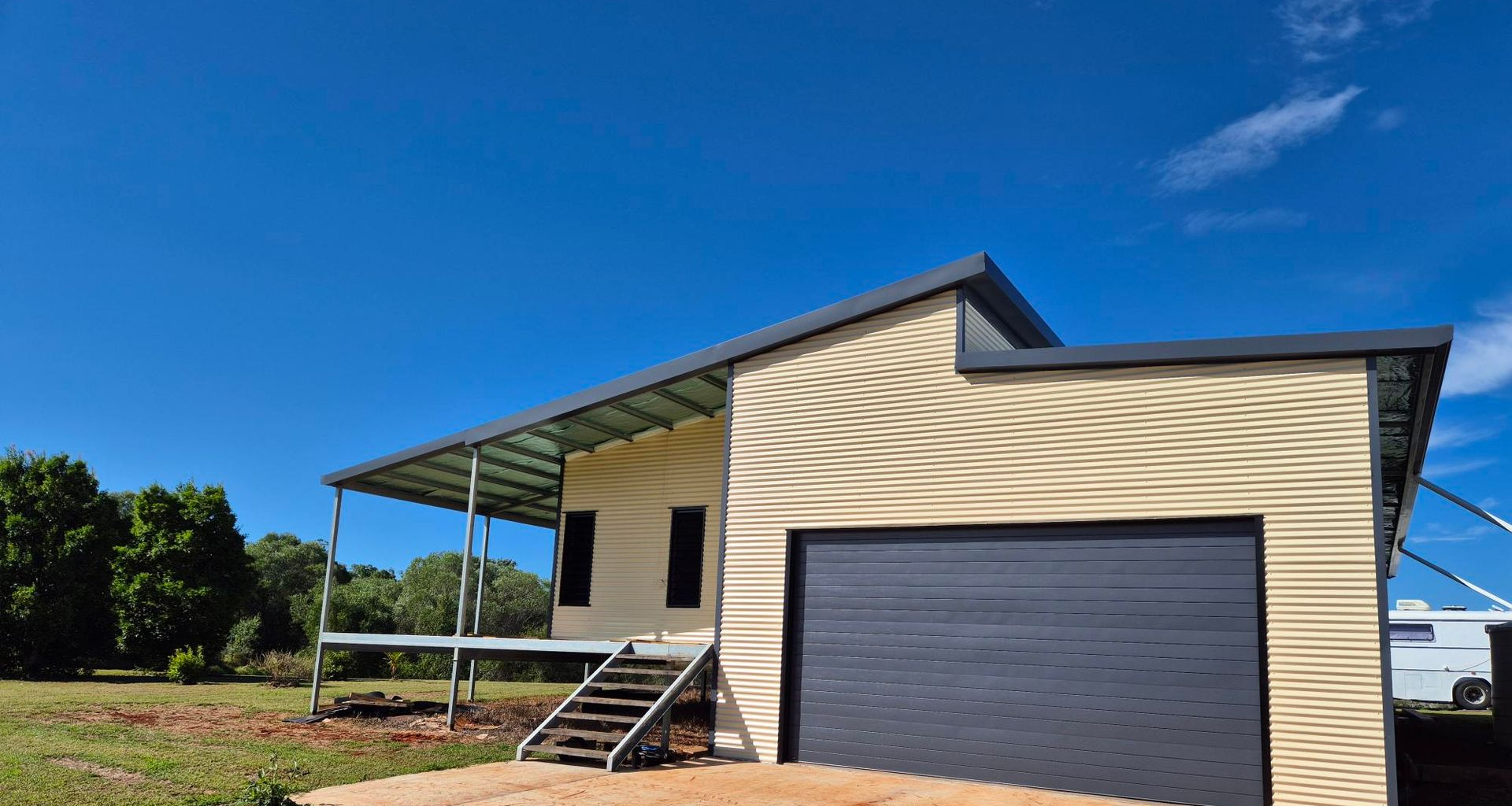 Container House Under Construction with Trees on Either Side — Bundy Tiny Homes and Carports in Branyan, QLD