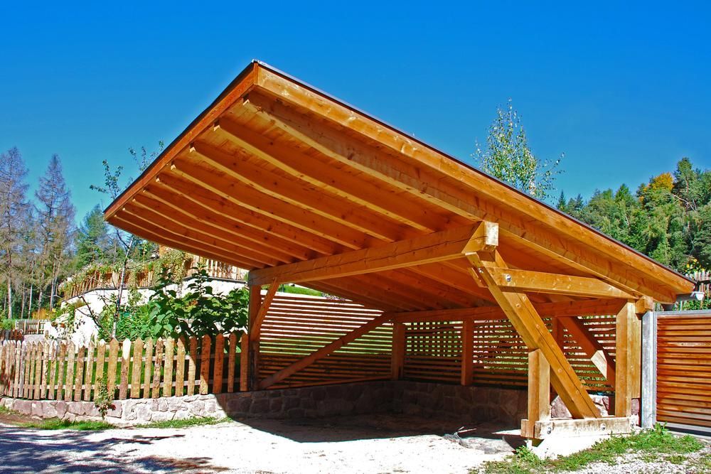 A Wooden Carport with A Blue Sky in The Background — Bundy Tiny Homes and Carports in Bargara, NSW