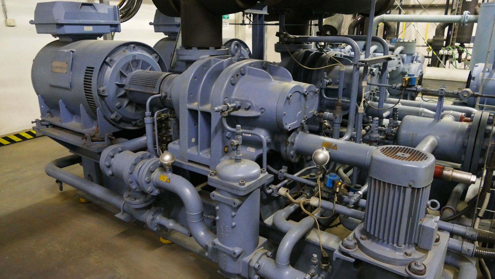 A large industrial machine with a lot of pipes and motors.