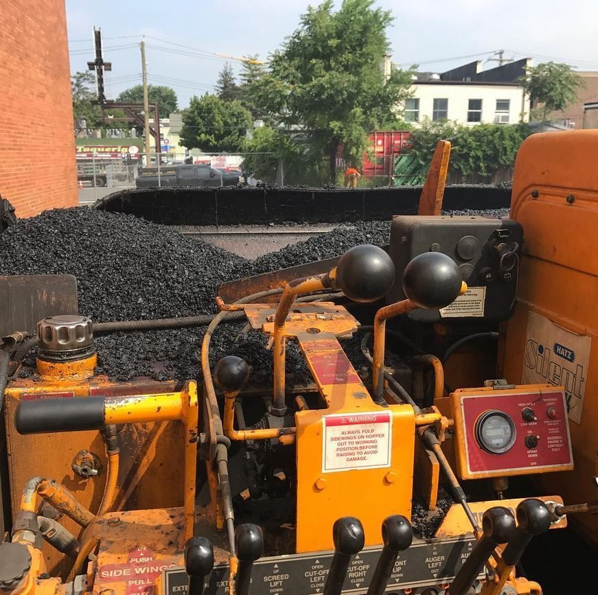 A yellow tractor with a warning sign on it
