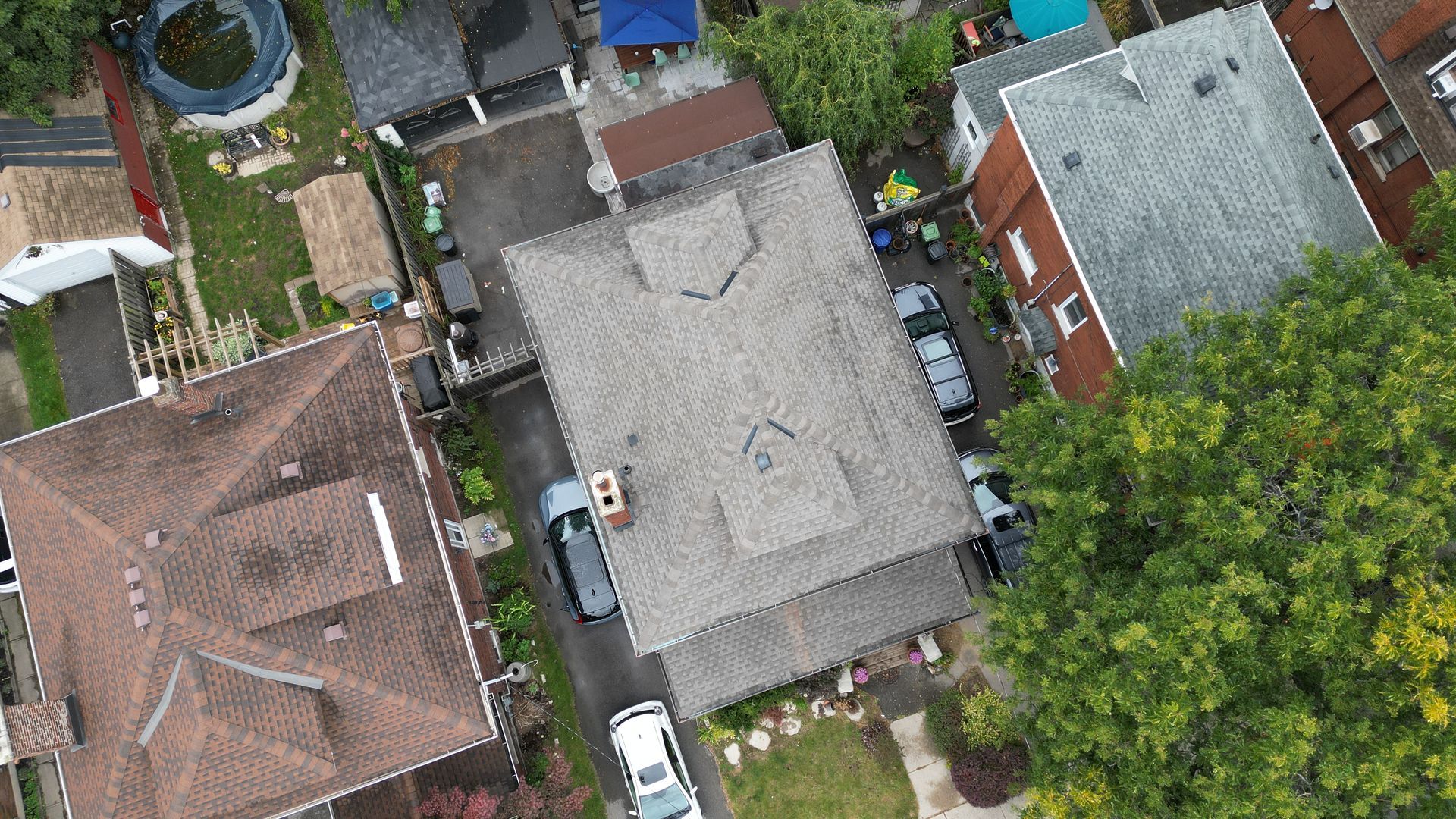 An aerial view of a residential area with houses and trees