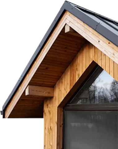 A house with a wooden roof and a large window