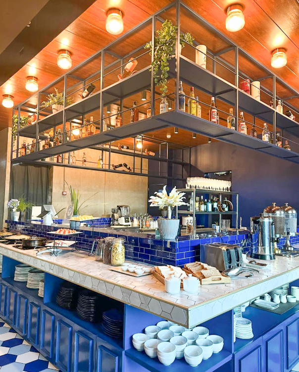 The stylish interior of Blu Fox Bistro, showing its modern blue buffet station, the heart of the best hotel staycation in Makati.