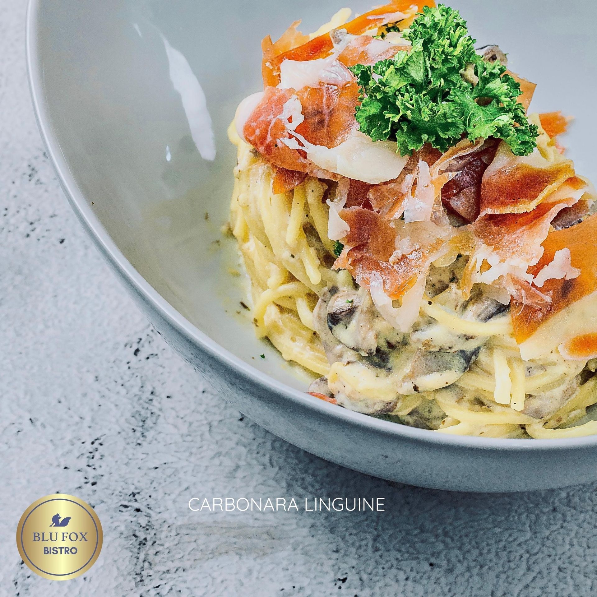 A delicious bowl of creamy seafood pasta from Blu Fox Bistro, a gourmet choice for your staycation in Makati.