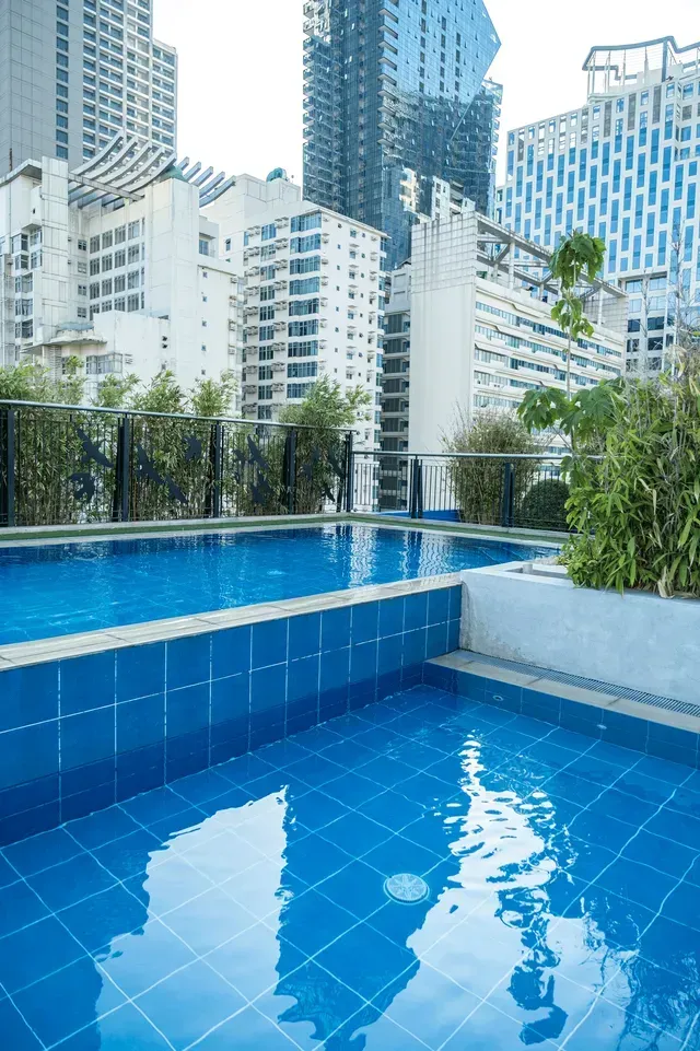  Rooftop swimming pool with Makati skyline views at Y2 Residence Hotel
