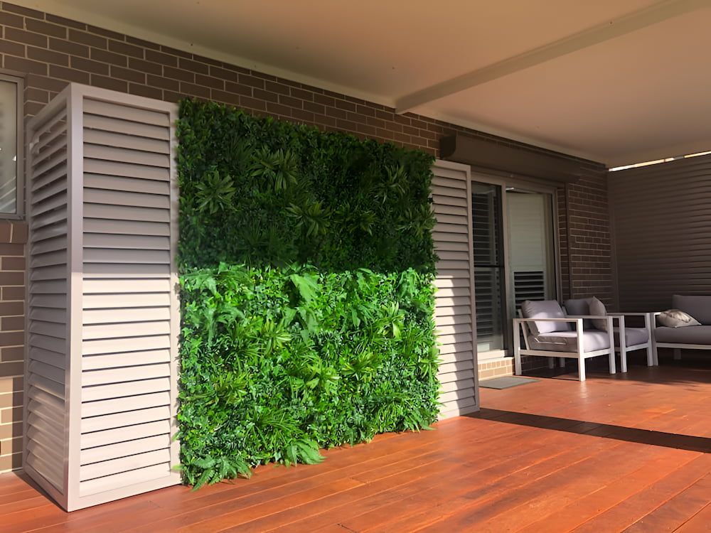 A Patio With a Green Wall and a Wooden Floor —  SCF Industries Pty Ltd in Albion Park, NSW
